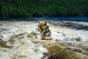 Group of rafters navigating whitewater rapids in Patagonia