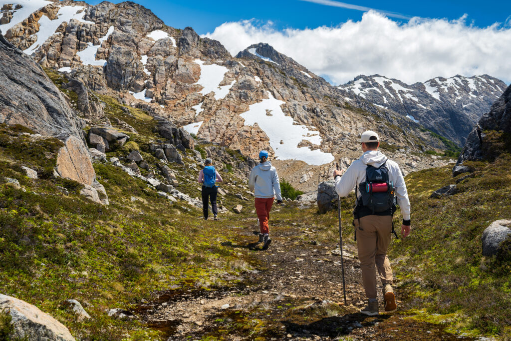Earth River guests hiking up rocky trails and Alpine mountains on Patagonia trip