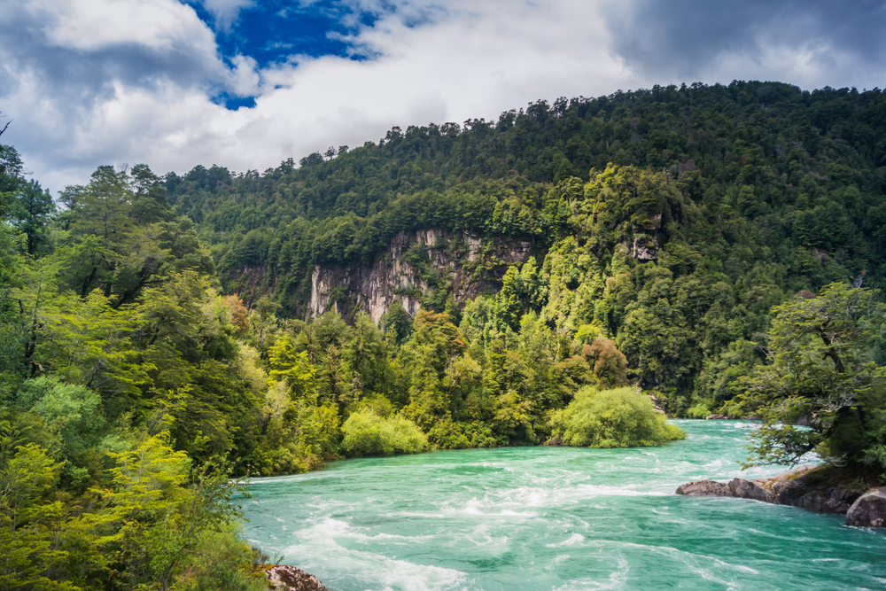 Beautiful rapids of Futaleufu River in Patagonia, Chile with lush green valley in background